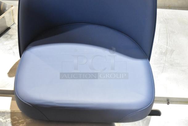 Brand new blue bar stool seat, featuring smooth upholstery, modern design, and durable construction. Perfect condition.