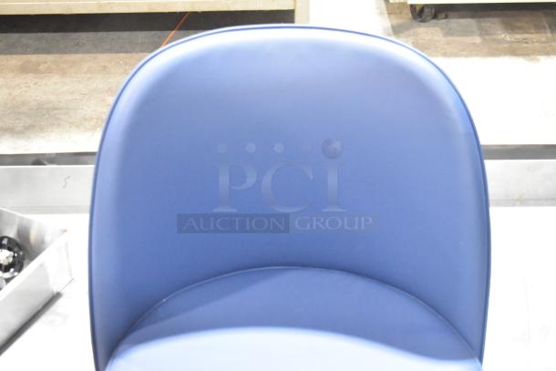 Brand new blue bar stool seat, smooth finish, ergonomic design, perfect condition. Ideal for modern interiors.