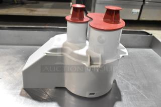 Brand new Robot Coupe gray poly continuous feed head for food processor. Some scratches and dents visible.