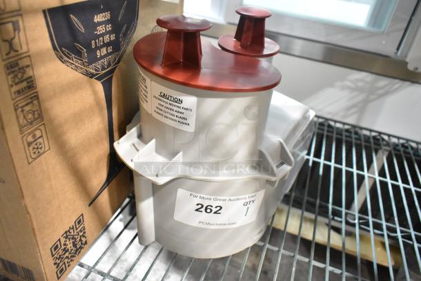 Brand new Robot Coupe gray poly continuous feed head for food processor, light scratches. Warning label visible.