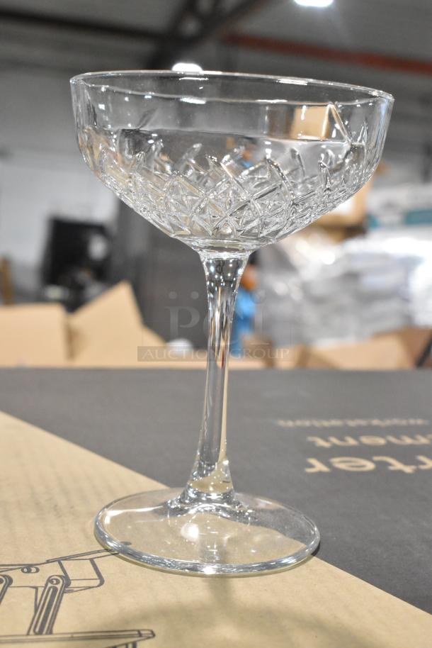 Box of 5 Pasabahce glasses, brand new condition, slight scratches, intricate detailing on stemware, ideal for collectors.