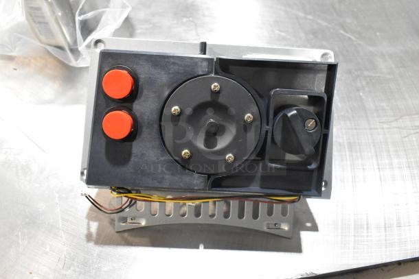 Stainless steel device with red buttons showing wiring; part of a new AyrKing 12" brush cover set.