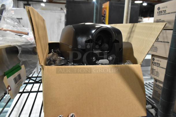 Brand new GOJO 2730-12 TFX 1200 mL black touchless hand soap dispenser, boxed, with potential scratch and dent marks.