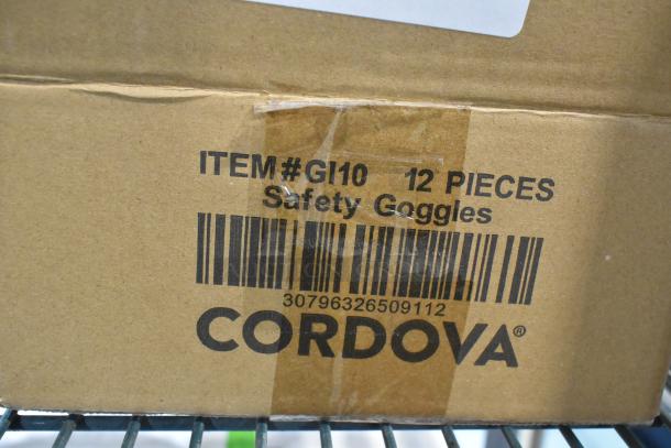 Cardboard box labeled "ITEM# GI10 12 PIECES Safety Goggles" with barcode and "CORDOVA" branding.