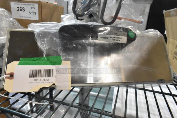 9 brand new scratch and dent items, including VacPak-It 186LED12U lid, labeled for UVME12SS, wrapped in plastic.