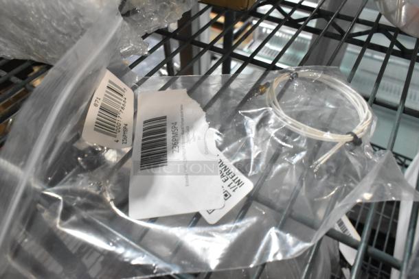 9 brand new scratch and dent items, including Estella Caffe 236PMSP4 Steam Wand Temperature Sensor, in original packaging.