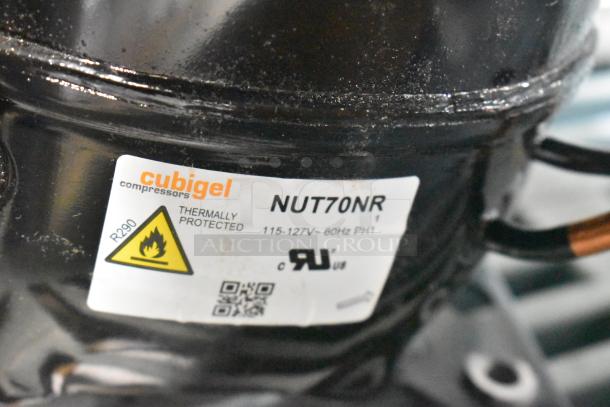 Brand new Cubigel NUT70NR compressor, scratch and dent condition, for Avantco series. Label shows thermal protection, 115-127V.
