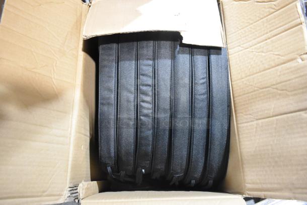 Box of new Lancaster Table & Seating black Chiavari chair cushions, 2" thick with ties, showing slight packaging wear.