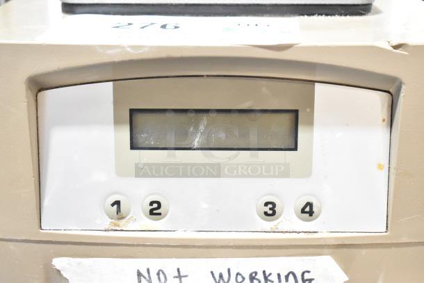 VitaMix VM0145 blender base, beige, with scuffs and scratches. Non-functional. Display and numbered buttons visible.