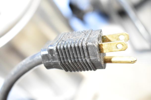 Plug view for Vitamix VM0145 blender base, included with 3-gallon tank in auction. Item shows standard usage.