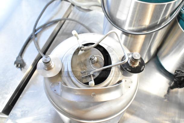 VitaMix VM0145 blender base with controls and ports, included with a 3-gallon stainless steel tank, in good condition.