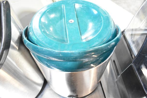 Two metal beverage dispensers with teal plastic lids, used condition, ideal for home or commercial use.