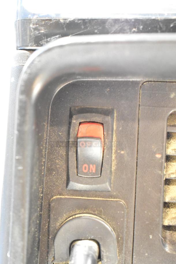 Close-up of a VitaMix VM0145 countertop blender's control panel, featuring an on/off switch.
