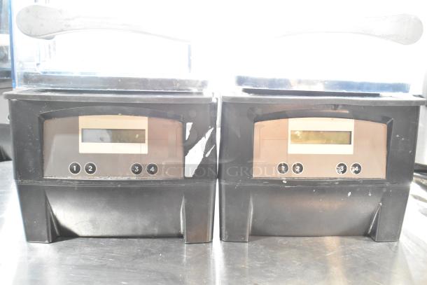 Two VitaMix VM0145 metal countertop blenders with sound enclosures, showing controls. Condition appears worn. 120 volts, 1 phase.