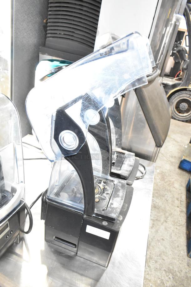2 VitaMix VM0145 metal countertop blenders with sound enclosures. Black base, clear enclosures. 120 volts, 1 phase.