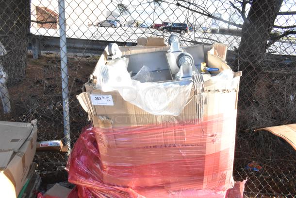 Brand new auction lot with BK-MIB-2422 stainless steel mobile ice bin and casters in packaging. Visible labels indicate quantity and details.