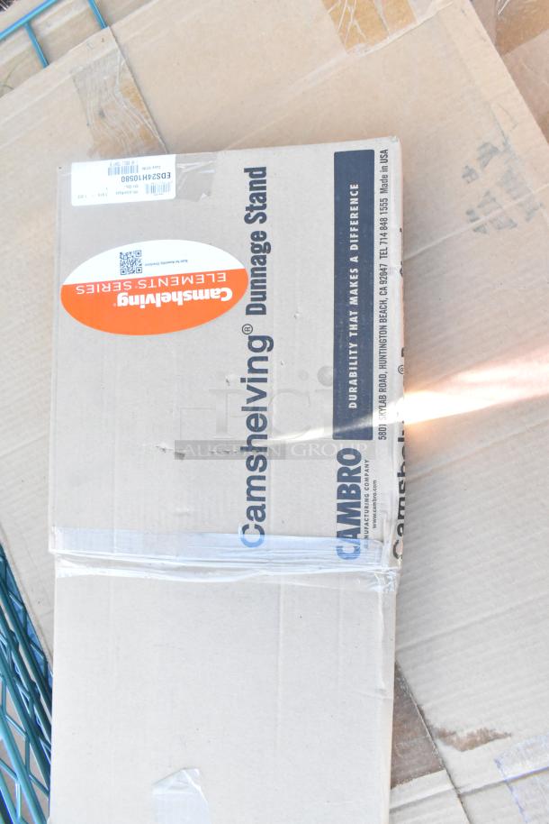 Box labeled "Cambro Camshelving Elements Series," sealed, new condition. Contains auction lot items including a John Boos soak sink.