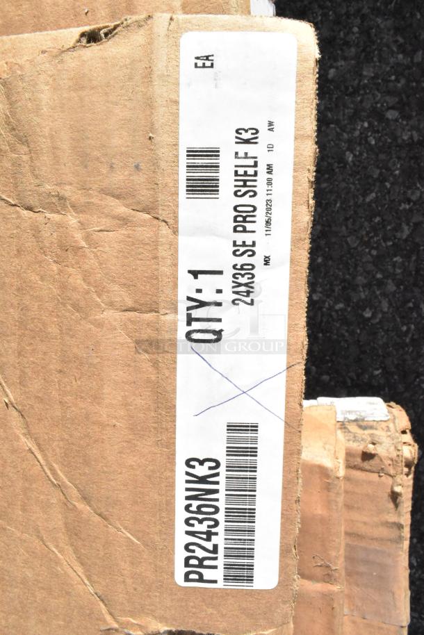 Cardboard box with label indicating "QTY: 1, 24x36 SE PRO SHELF K3, PR2436NK3." Box is slightly worn.