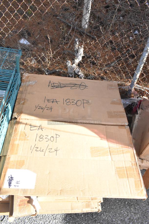 Cardboard boxes with handwritten labels reading "1EA 1830P 1/26/24" and "ADD 2.0," next to a metal rack. Boxes contain new John Boos PB-SS-208 items.