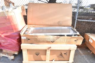 2 new Advance Tabco work tables in boxes; KMSLAG-305-X with backsplash/undershelf and KMS-11B-304R with prep sink.