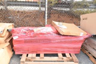 12 new items wrapped in red plastic, including an oven rack, Metro SMA24A-ADD 24" shelf arm, and Metro 2460DRK3 shelf.