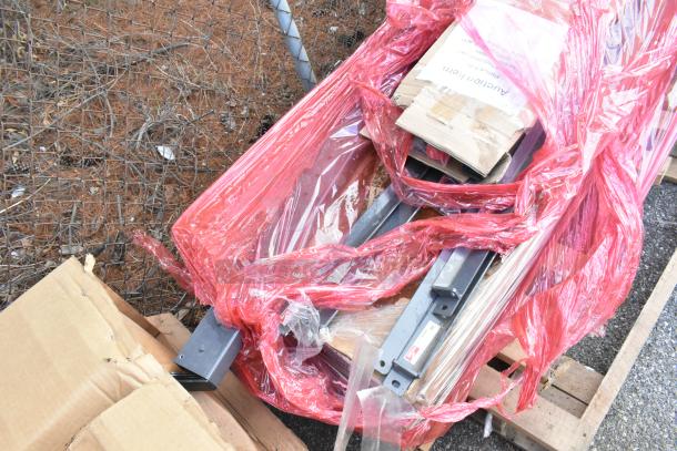 Alt text: New oven rack, Metro SMA24A-ADD 24" SmartLever shelf arm, Metro 2460DRK3 dunnage shelf, wrapped on pallet.