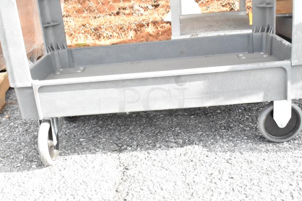 2 gray poly 3-tier carts, commercial casters, durable, excellent condition, ideal for heavy-duty use.