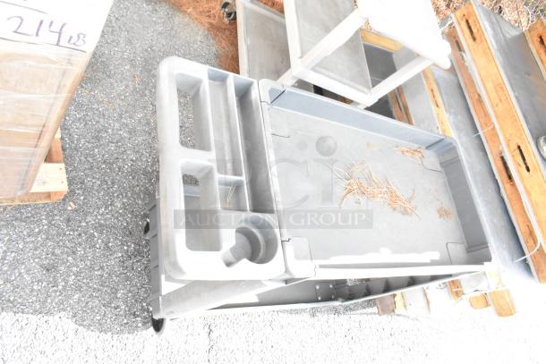 2 gray poly 3-tier carts on commercial casters, lightly used. Durable design, ideal for commercial use, batch auction.