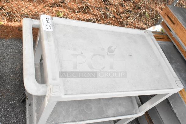 2 gray poly 3-tier carts with commercial casters, shown in good condition. Tag reads “294, 2x, Qty: 2”.