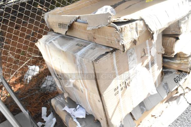 Damaged cardboard boxes with visible labels, including "Made in China" and "600W." Contains 11 scratch and dent items like speed rail and dump sink.