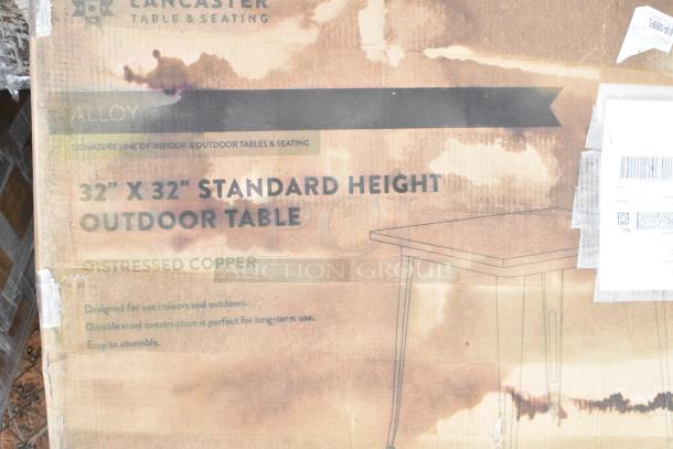 Cardboard box labeled "Lancaster Table & Seating" with details of a 32"x32" standard height outdoor table in distressed copper.
