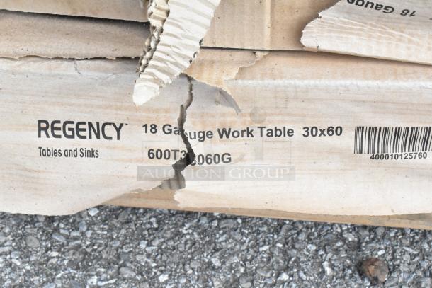 Regency 18 Gauge Work Table in damaged box, model 600T3060G, 30x60 inches, scratch and dent condition, barcode visible.