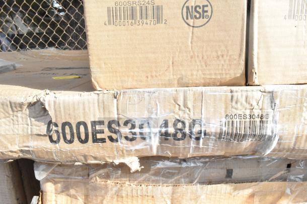 Cardboard boxes with NSF label and model numbers 600SRS24S, 600ES3048G. Boxes show "scratch and dent" wear.