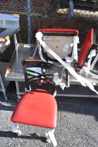 Black metal cross-back dining chair with red seat cushion. Appears in good condition, suitable for dining settings.