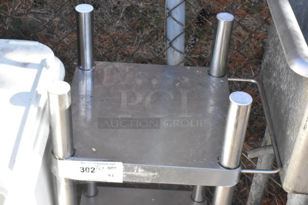 Stainless steel rice cooker equipment stand with under shelf, commercial casters, and visible label "302". Used condition.