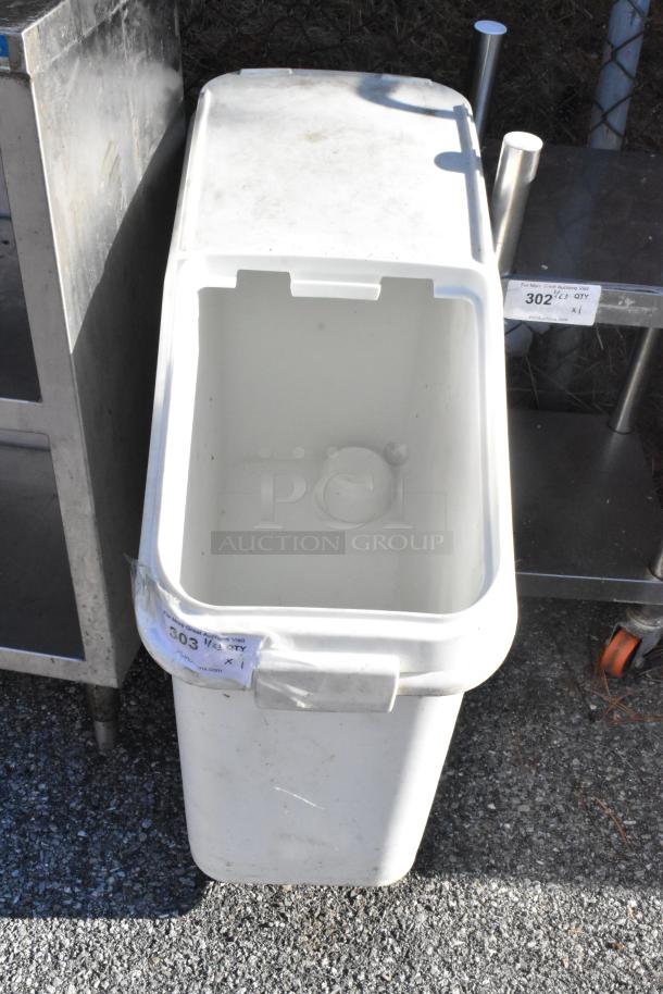 White poly ingredient bin on casters, open top, visible wear, tag marked "303 1/2" on side.