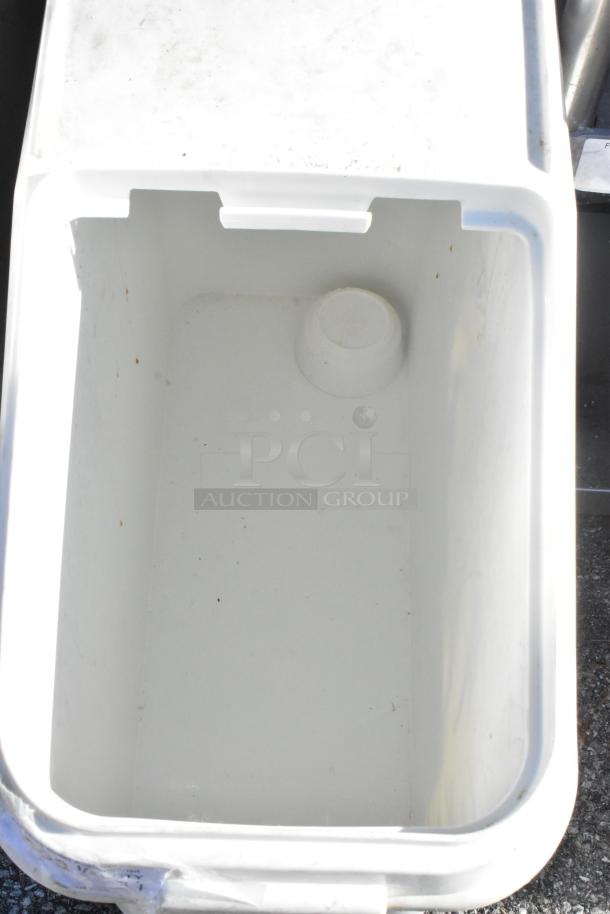 White poly ingredient bin with lid, mounted on casters for mobility. Clean interior, minor exterior marks, ideal for storage.