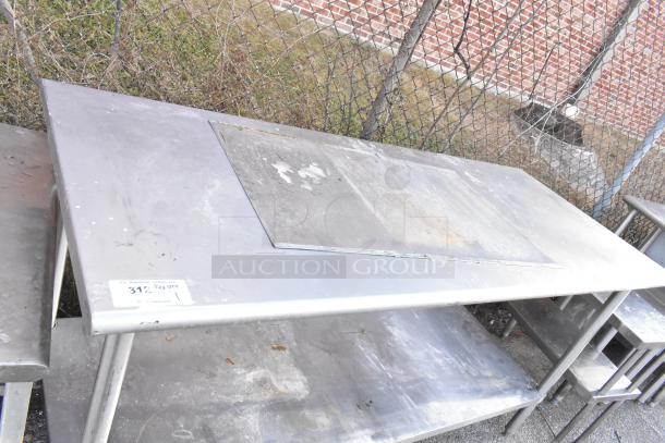 Stainless steel table with metal under shelf, showing wear and rust. Label indicates quantity: 312 1/2 QTY.