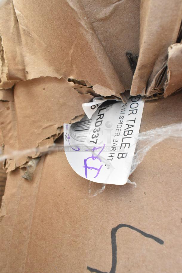 Cardboard box showing a partially visible label for 427TBCLRD337 outdoor table base column, marked with "Scratch and Dent."