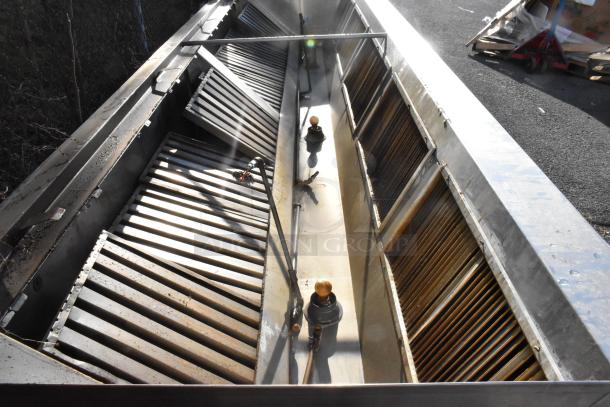 14.5' stainless steel return air grease hood, includes filters and lights, used condition, visible vent slats and light fittings.