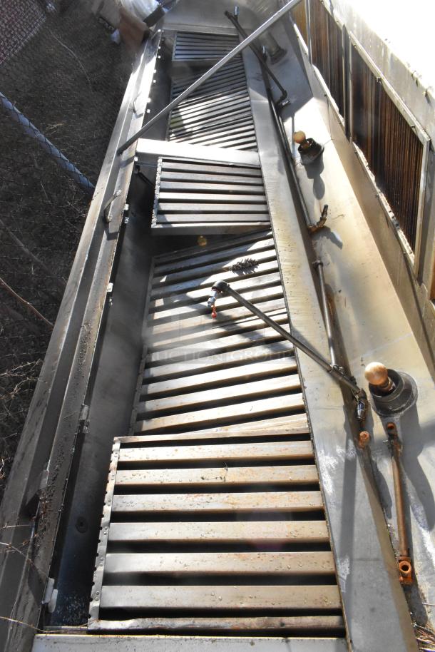 14.5' stainless steel grease hood with filters and lights, showing minor rust. Features return air system, used condition.