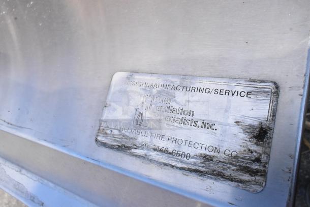 8' stainless steel grease hood with filters and lights; label shows manufacturing details for kitchen ventilation specialists.