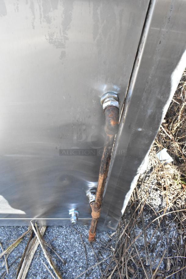 8' stainless steel grease hood with filters and lights. Visible exterior features and rusted pipe attachment.