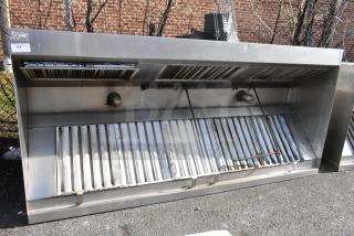 9.5' stainless steel return air grease hood with filters and lights, in used condition, shows visible wear.