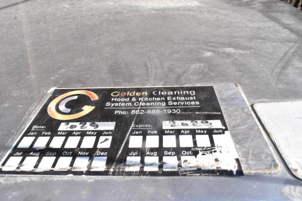 9.5' stainless steel return air grease hood with filters and lights. Shows a service label indicating last cleaning in 2023.