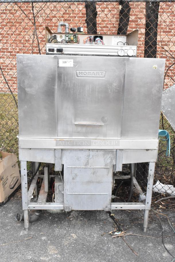 Hobart C44A stainless steel commercial conveyor dishwasher, floor style, 480 volts, 3 phase, visible wear, needs cleaning.