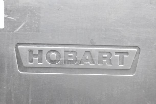 Hobart C44A stainless steel commercial dishwasher, sturdy build. 480V, 3 phase. Hobart logo is visible.