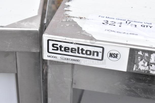 BRAND NEW Steelton 522EBT3060D 30"x60" 18 gauge 430 stainless steel work table. Scratch and dent. Model label visible.