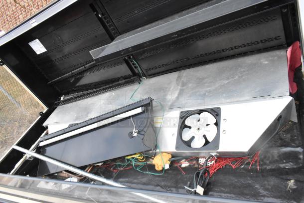 Hussmann Q3-SS-6S Metal Commercial Merchandiser with internal components and fan visible. 208/240V, 1 Phase.