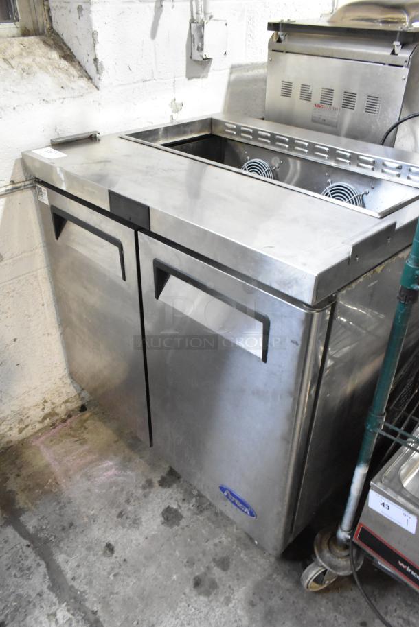 2022 Atosa MSF3610GR stainless steel commercial prep table on casters, 115 volts, 1 phase, in good condition.